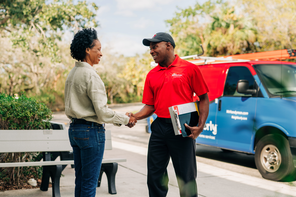 A service professional from Mr. Handyman (Hinsdale, IL) meeting with a client.