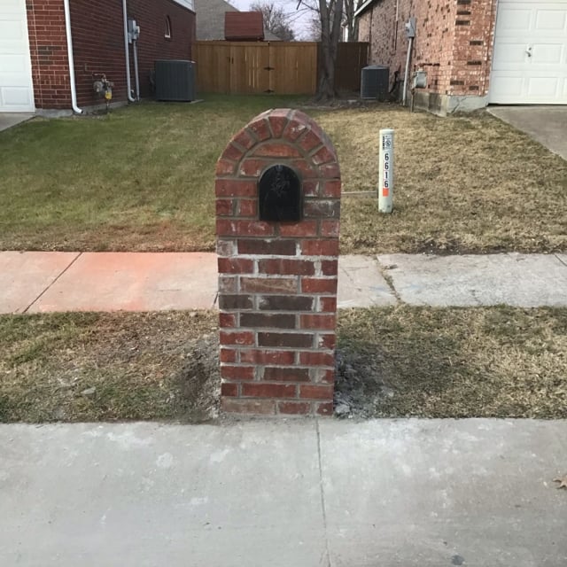 Brick mailbox outside of a home.