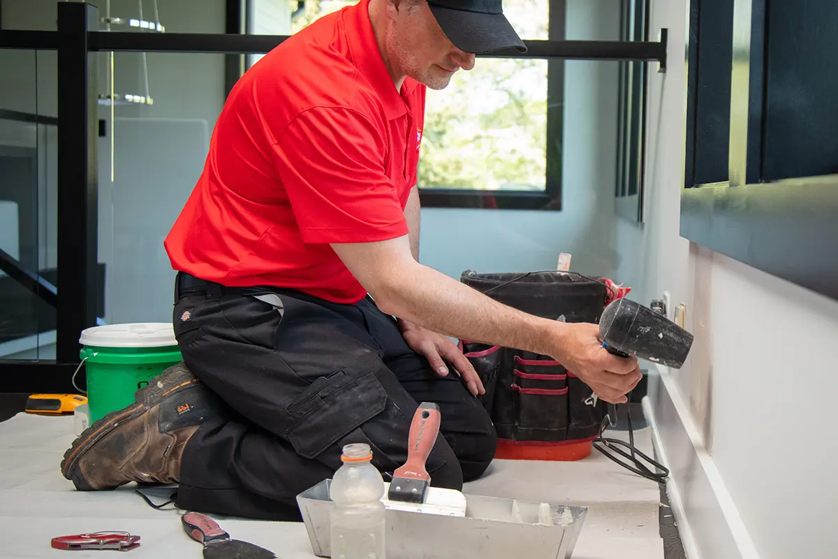 MRH service professional painting the interior of a house.