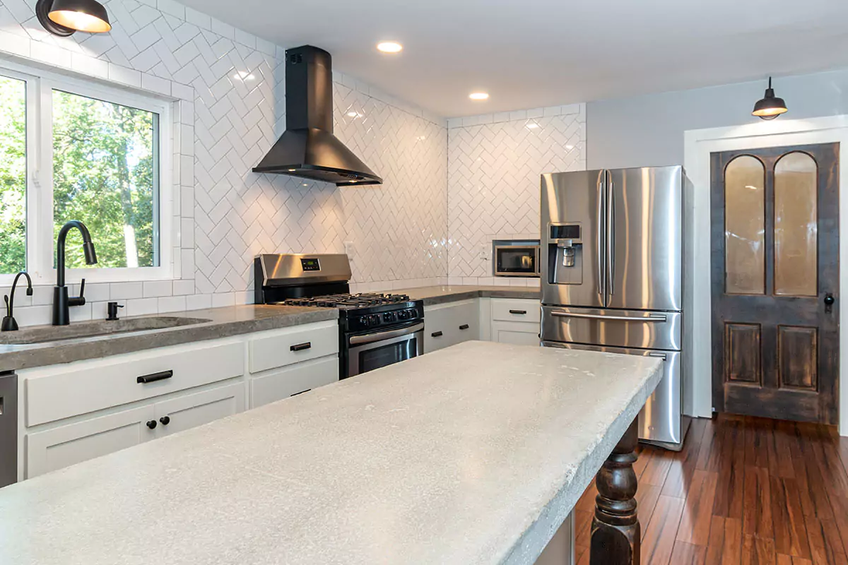 view of kitchen with concrete countertops