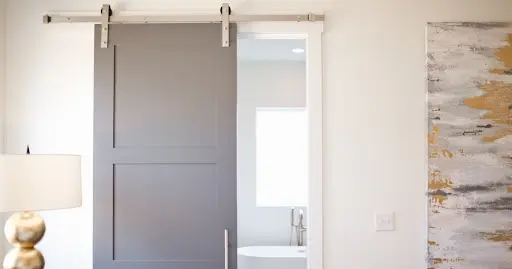 A barn door that has been installed in a home.