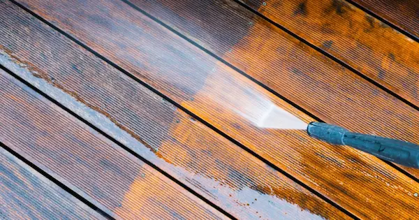 Pressure washing on a deck.