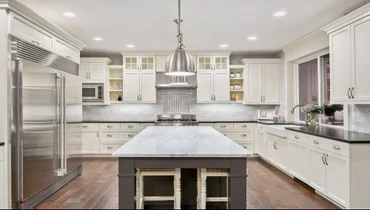 Mrh Kitchen With Wood Floors And White Cabinets And Marble Counter Tops.webp