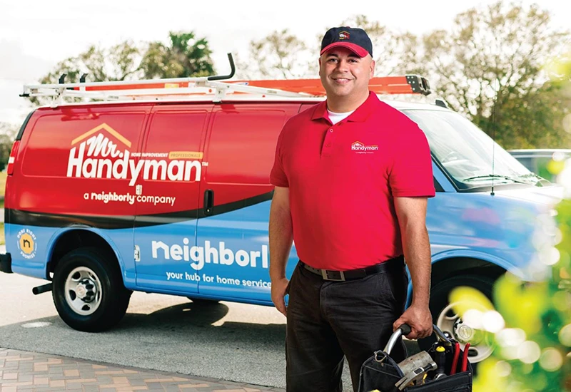 Mr. Handyman tech ready to perform home repairs in one of many service locations